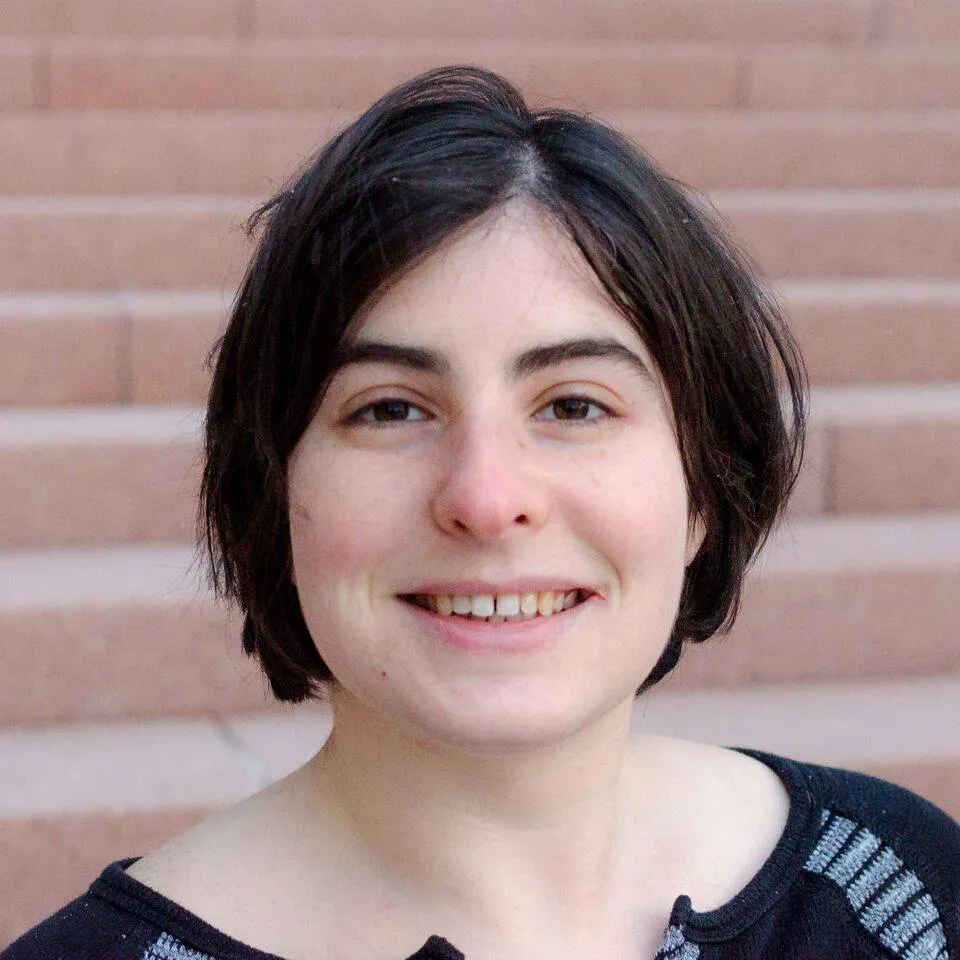 Photo of Sarah Joseph in front of stairs
